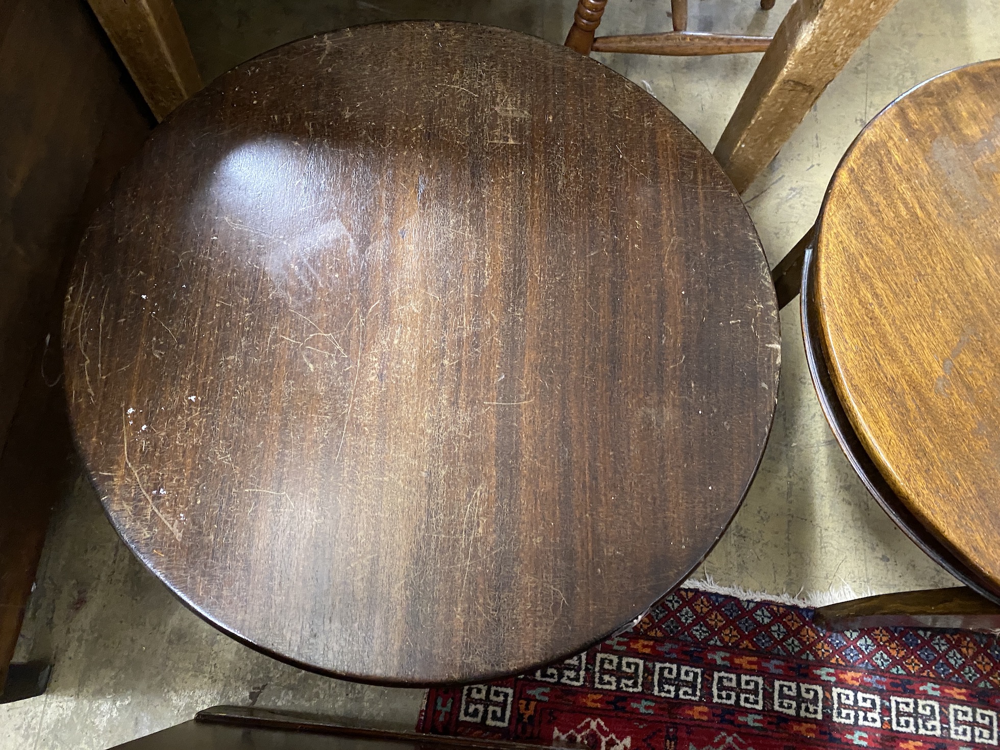 A pair of circular mahogany and beech occasional tables, diameter 61cm, height 46cm